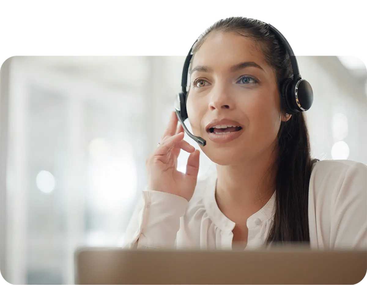 Woman using headset to find a provider in network for a member