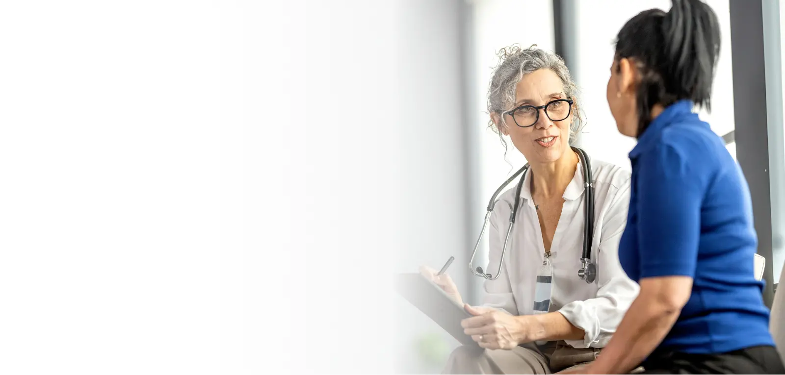 A HOMELINK network provider discussing care options with a patient