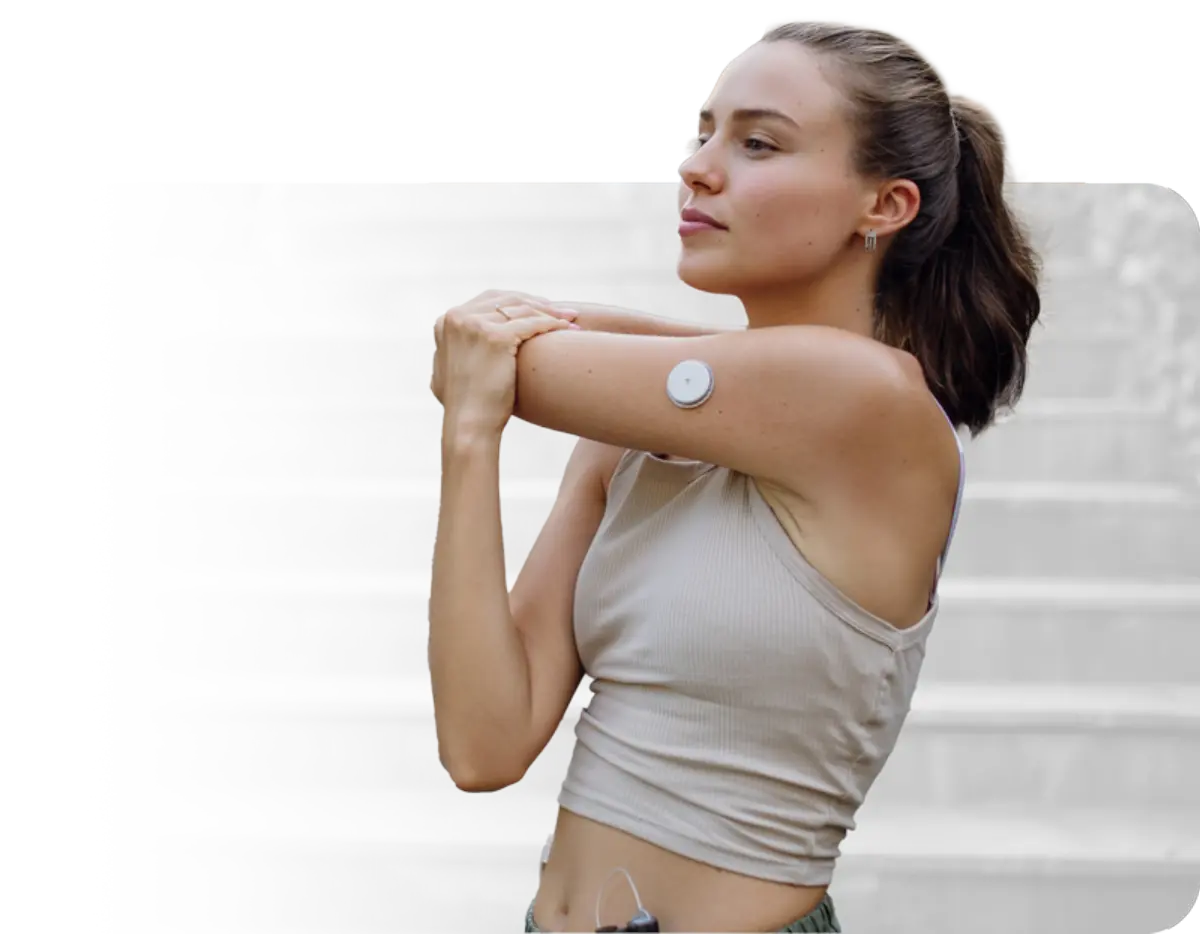 Woman stretching with medical device in arm