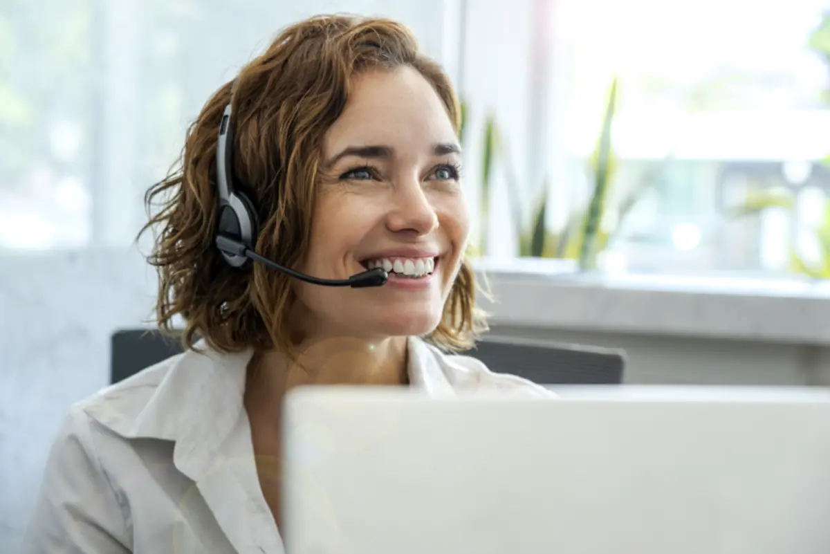 Woman wearing headset supporting care coordination